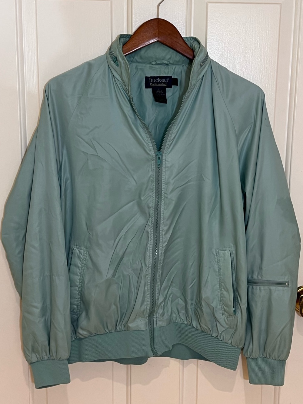Vintage women’s Light Sage Green Zip-Up Duckster Jacket with hidden hood